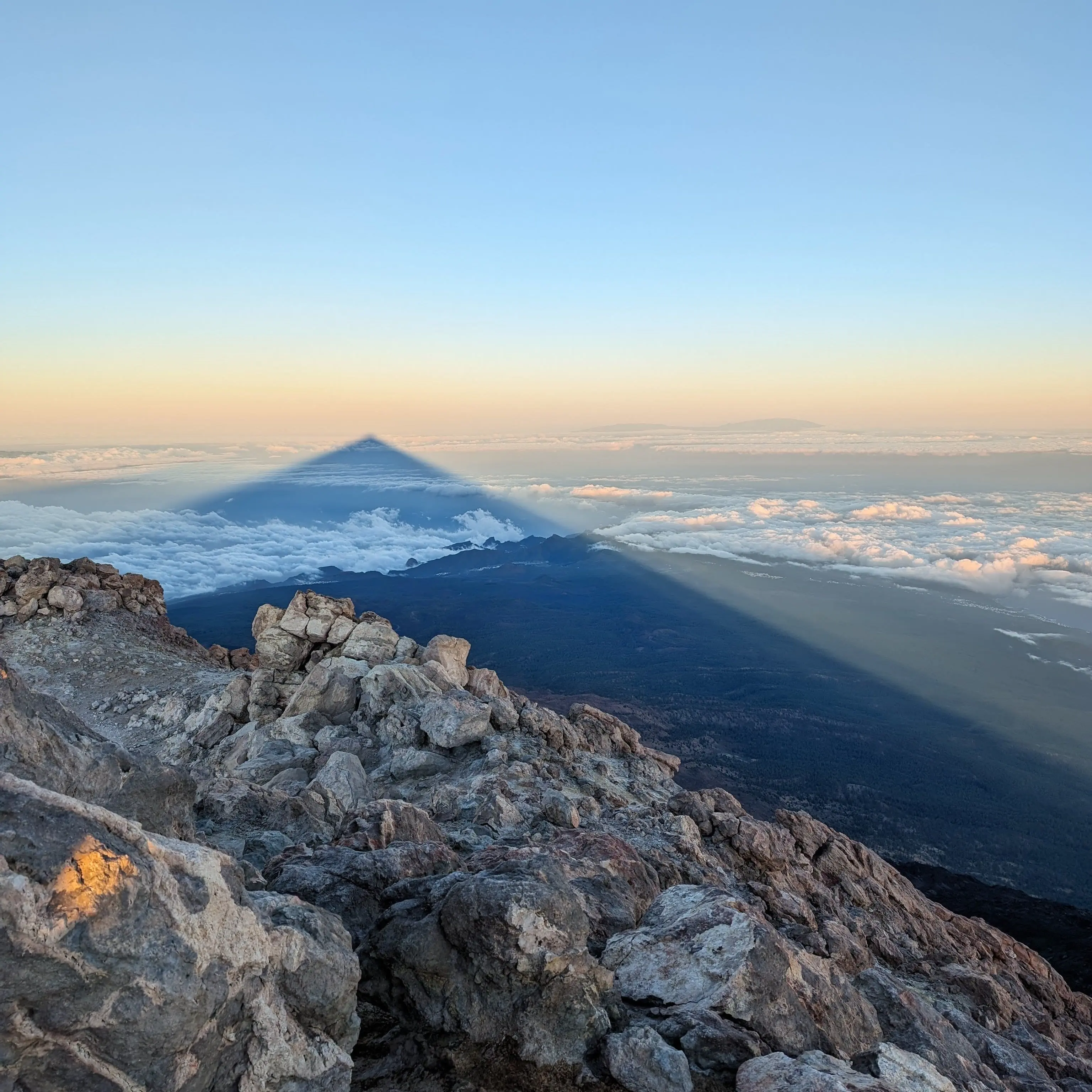 Mountain casting shadow at sunrise