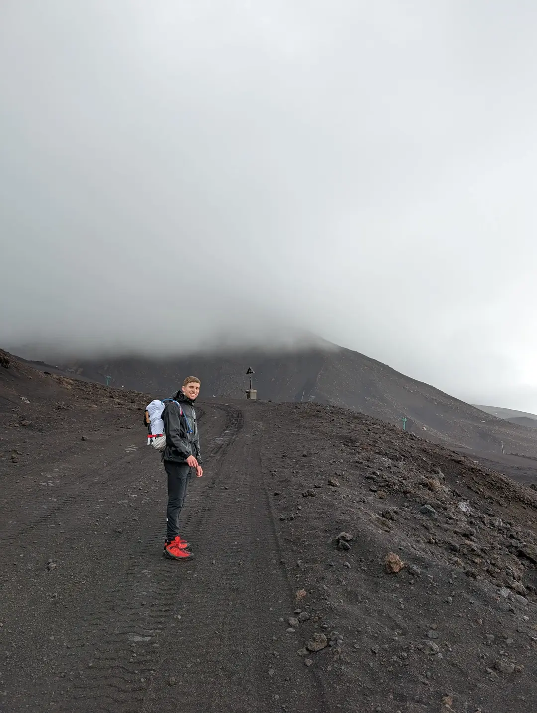 A walker on the barren volcano.