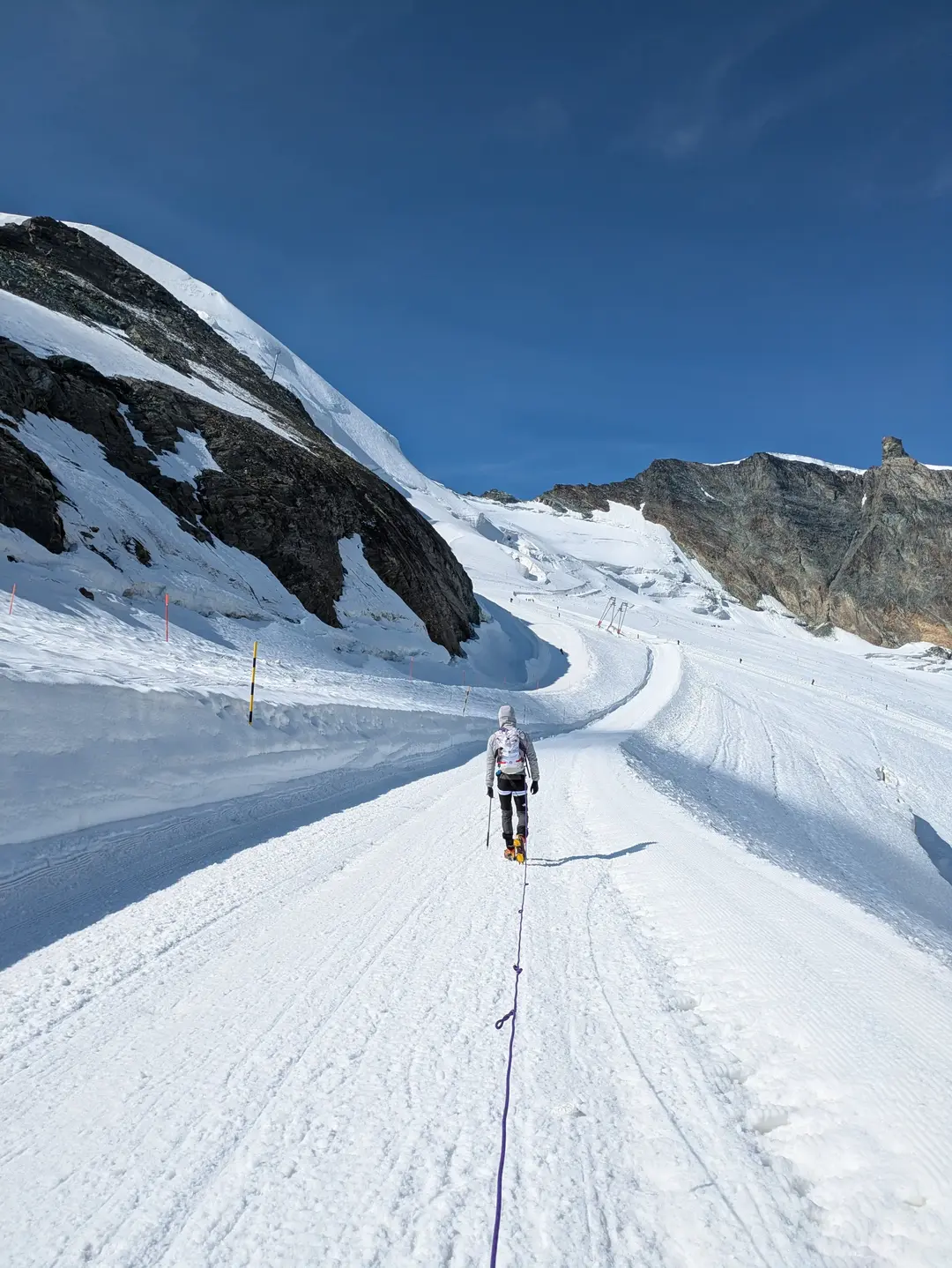 Mountaineers heading out on the route with a rope.