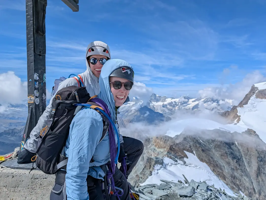 All smiles under the summit cross.